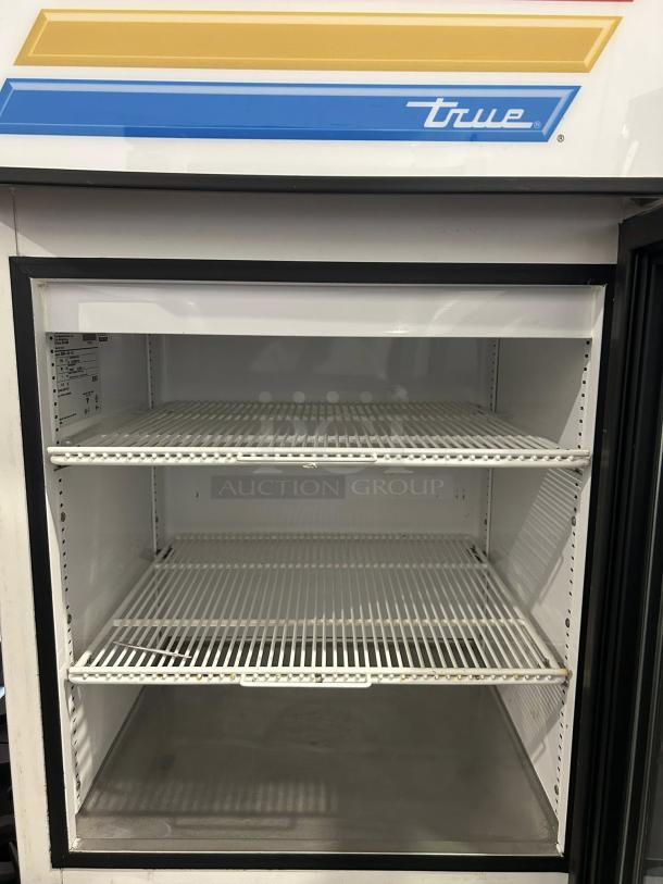 True GDM-05-HC~TSL01 black glass door refrigerated merchandiser, excellent condition, tested working, 23 3/8" wide.