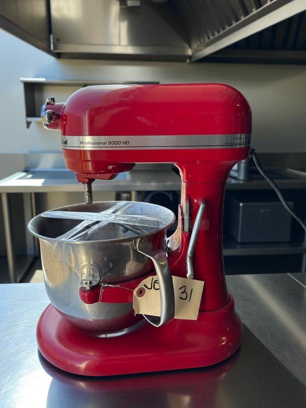KitchenAid KSM55 5.5 Quart Bowl-Lift Stand Mixer, red, great condition, tested and working, with tag labeled "31".