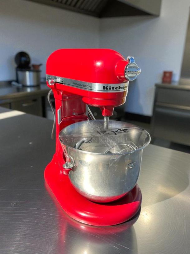 Red KitchenAid KSM55 5.5 Quart Bowl-Lift Stand Mixer in great condition, tested and working, with visible KitchenAid logo.