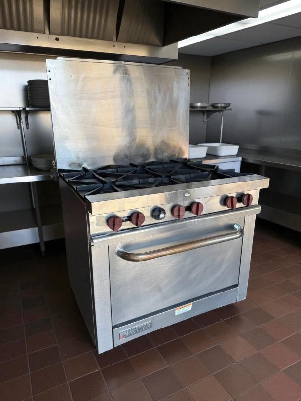 Wolf WX36-6B gas restaurant range, six burners, tested working, stainless steel, excellent condition, visible Wolf logo.