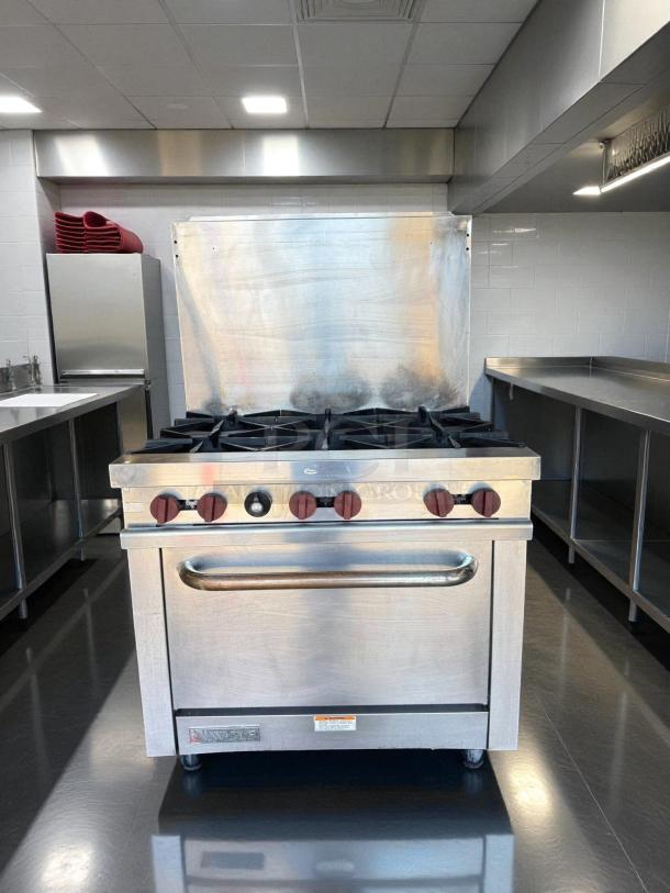 Wolf WX36-6B gas range, 36" with 6 burners, stainless steel, tested working. Features easy-to-use knobs and sturdy construction.