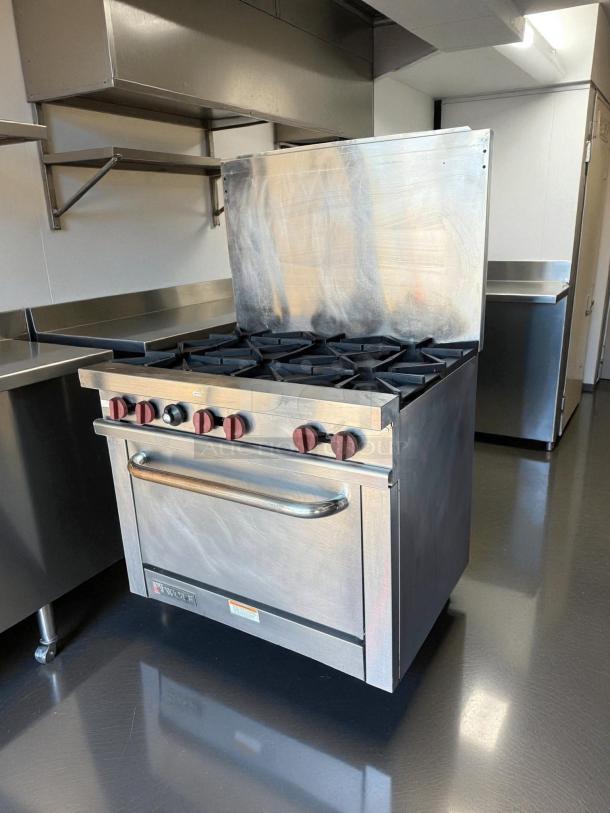 Wolf WX36-6B 36" gas restaurant range with 6 burners, stainless steel, excellent condition, tested and working.