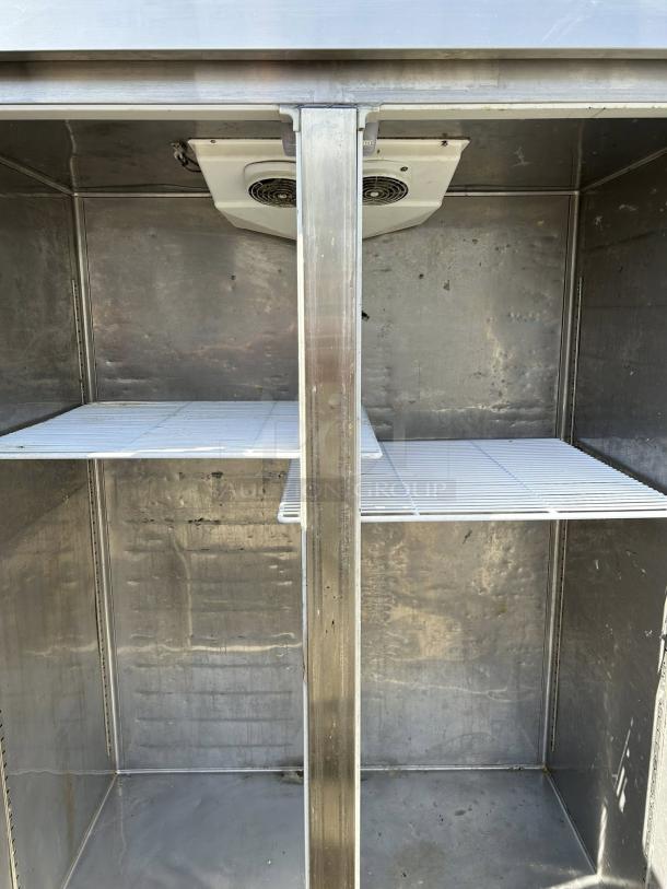 Everest ESR2 49" reach-in refrigerator, two sections, two solid full doors, top mount, shelves inside, great condition.