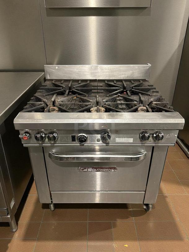 Southbend S36D 36" natural gas range with 6 burners and standard oven. Tested, working condition, stainless steel finish.