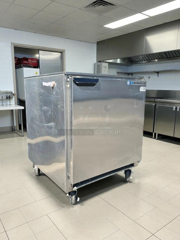 Beverage-Air UCR27AHC undercounter refrigerator, 27", stainless steel, tested, working, one solid door, shown on casters.