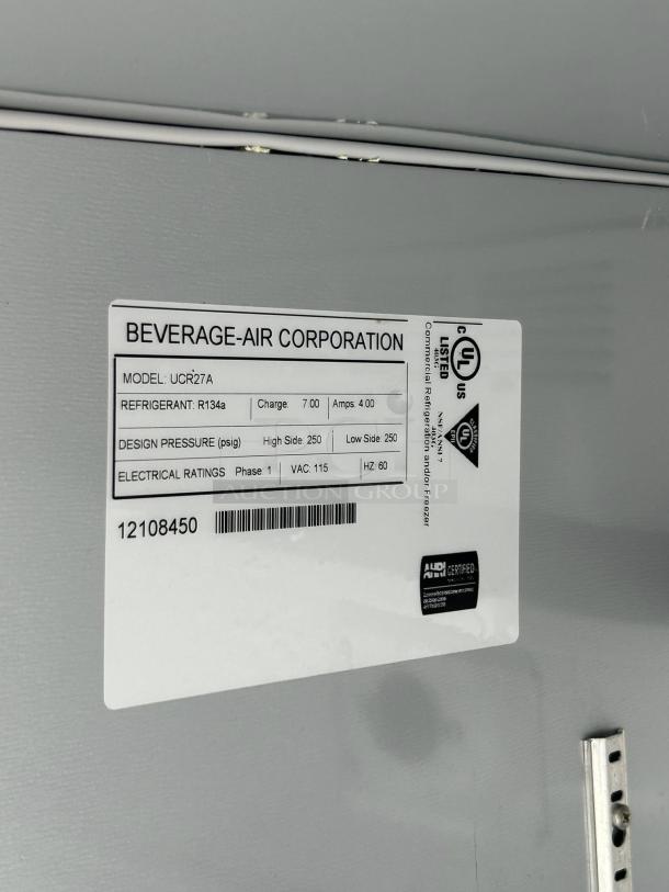 Beverage-Air UCR27AHC undercounter refrigerator label showing model, refrigerant type, and electrical ratings.