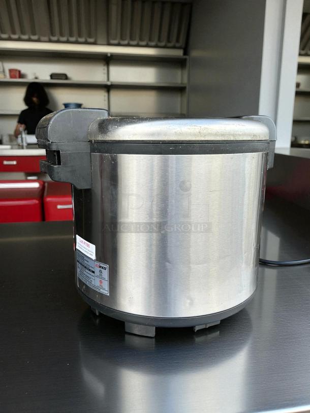 Winco RW-S451 rice warmer in excellent condition, stainless steel, 100-cup capacity, tested and working. Visible label indicates model.