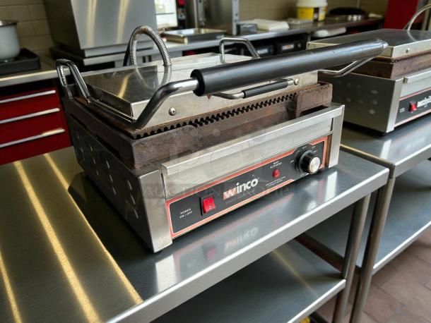 Winco EPG-1C panini press, cast iron grooved plates, stainless steel body, tested, working, 120v, power controls visible.
