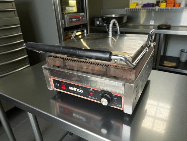Winco EPG-1C commercial panini press with cast iron grooved plates, tested and working, stainless steel exterior, 120v.
