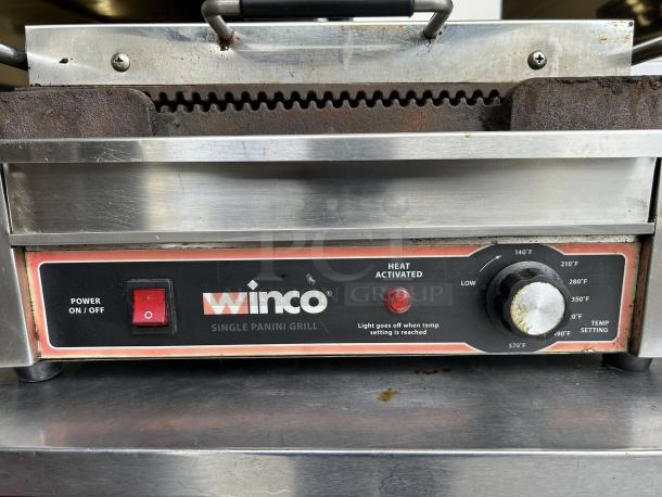 Winco EPG-1C Single Panini Press with cast iron grooved plates, rust marks visible, 120v, power switch and temperature dial.