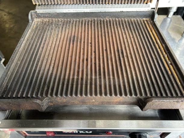 Winco EPG-1C single commercial panini press with cast iron grooved plates. Tested and working, 120v, visible wear.