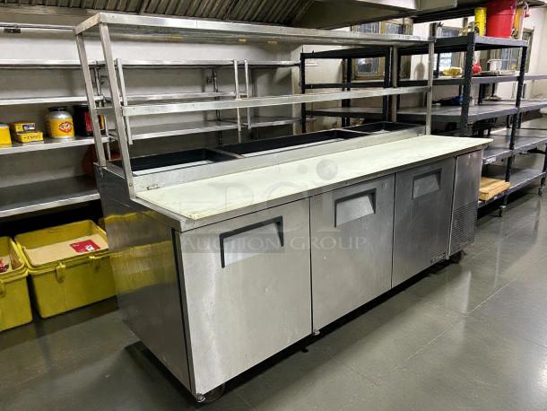 True TPP-93 93" 3-door refrigerated pizza prep table with overshelf. Tested, working condition. Stainless steel.  
