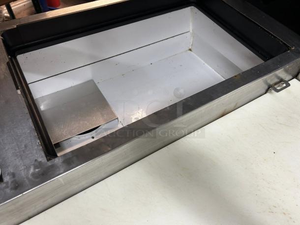 True TPP-93 pizza prep table close-up, stainless steel with overshelf, showing interior. Good condition, tested and working.