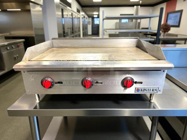 Kintera countertop gas griddle, 36"W, with thermostatic control and 3 burners. In great condition, tested working.