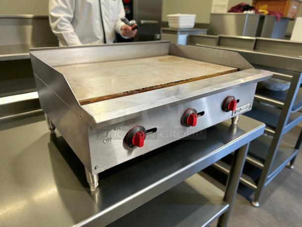 Kintera countertop gas griddle, 36"W, in excellent condition. Features thermostatic control and three burners.