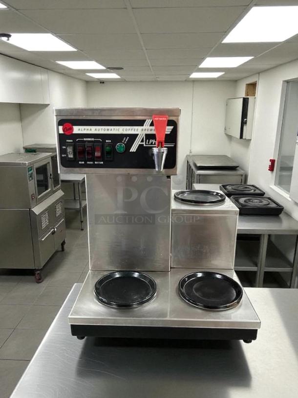 Curtis ALP3GTR12A000 12-cup coffee brewer with three lower warmers on right. Stainless steel. Tested, working condition.