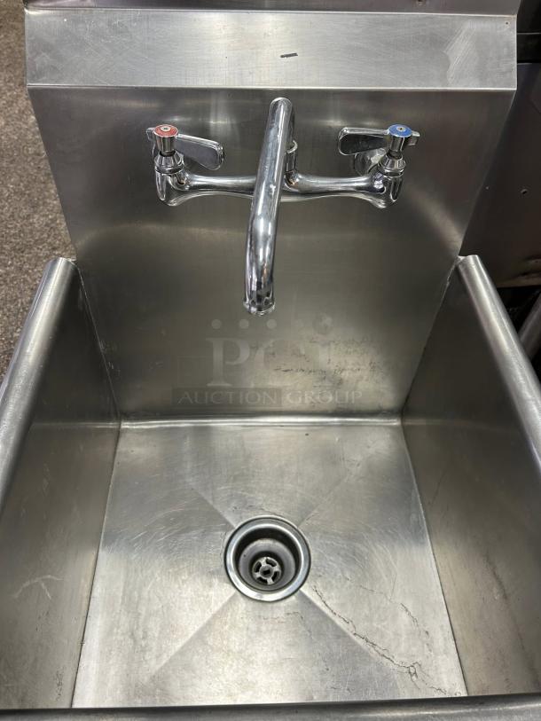 Single compartment stainless steel sink, great condition, features hot and cold faucets, durable design, ready for installation.