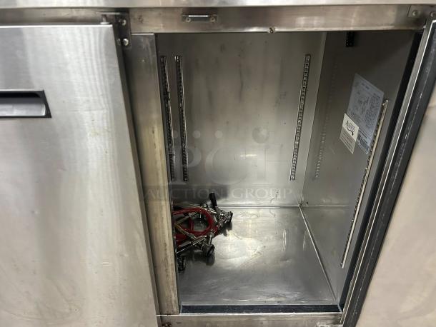 Avantco UDD-72-HC kegerator interior, stainless steel, three 1/2 keg capacity, double tap system, visible model label.