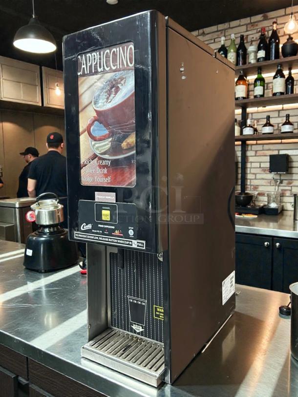 Curtis PC 1D-10 self-serve cappuccino machine in excellent condition, tested and working. Features include push-button operation and overflow prevention.