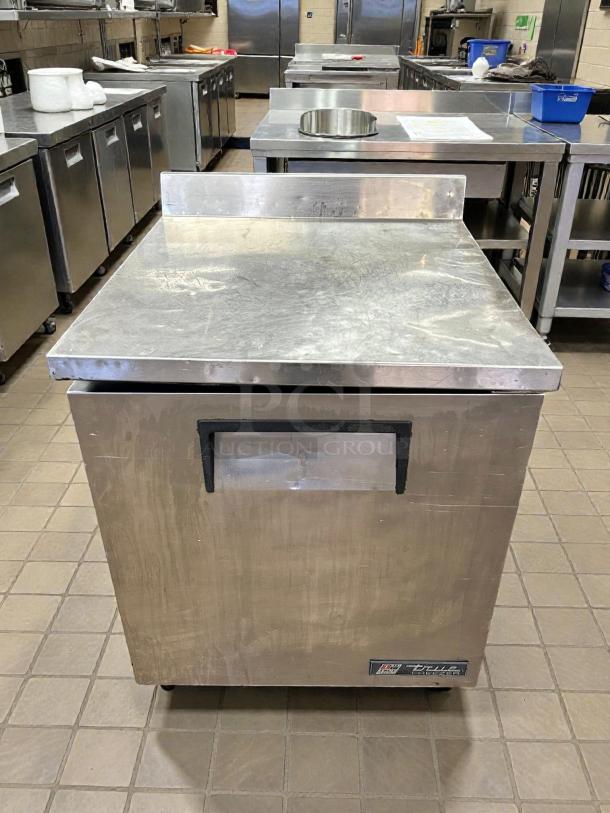 True TWT-27F-HC 27" worktop freezer in excellent condition, features 3 9/16" backsplash, tested and working, visible True logo.