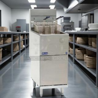 Pitco 40D 40 LB natural gas deep fryer in excellent condition, stainless steel, tested and working, restaurant setting.