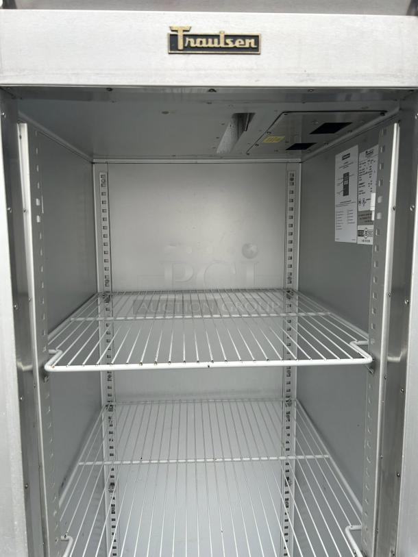 Traulsen G11010 refrigerator, one glass door, excellent condition, right hinge, 29 7/8", 115v, interior shelving visible.