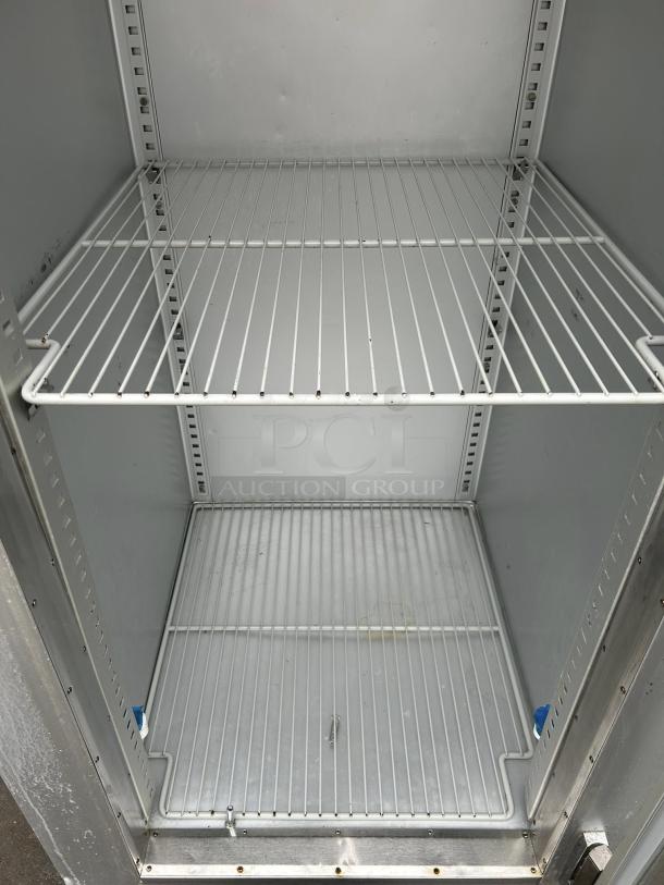 Traulsen G11010 reach-in refrigerator with right hinge glass door, excellent condition, tested, working, includes wire shelves.