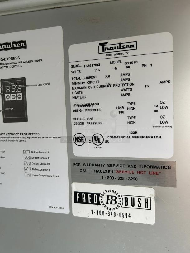 Traulsen G11010 refrigerator label detailing specs, volt 115, and serial T55917I03. NSF and UL listed markings.