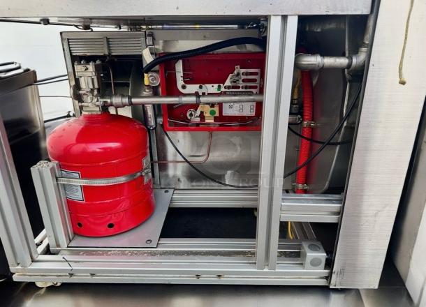 Apace UM1EGA ventless hood system, 208V, prime condition, showing inner components and red fire suppression tank.