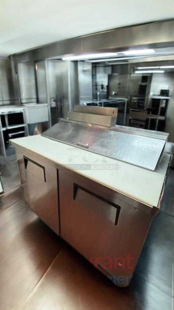 TRUE TSSU-60-12 sandwich prep table, stainless steel, 2-door, prime condition, fully tested, by TRUE Manufacturing.