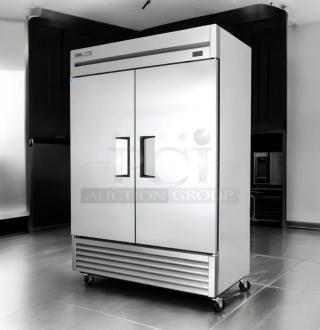 Immaculate True T-49-HC reach-in refrigerator, stainless steel, dual doors, fully tested, on casters, True Manufacturing brand.