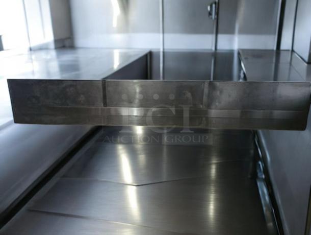 Pristine condition commercial stainless steel exhaust hood, fully tested, working, reflective surface, ideal for kitchens.