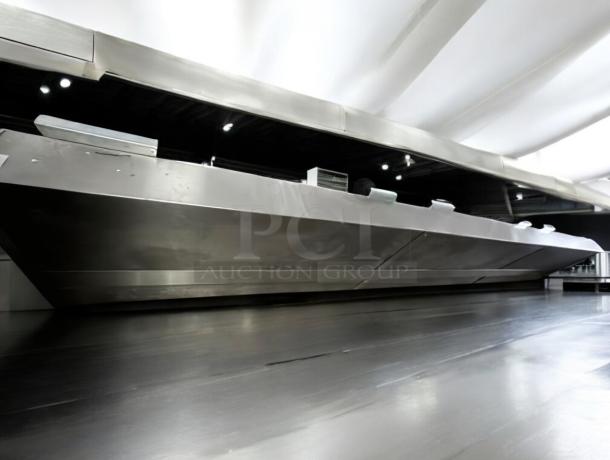 Pristine commercial stainless steel exhaust hood, fully tested, impeccable condition, sleek design, ready for installation.