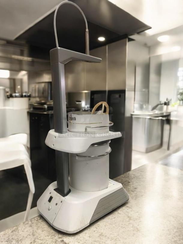DoughPro pizza dough rounder, prime condition, fully tested. Features durable construction, streamlined design, excellent for commercial kitchens.