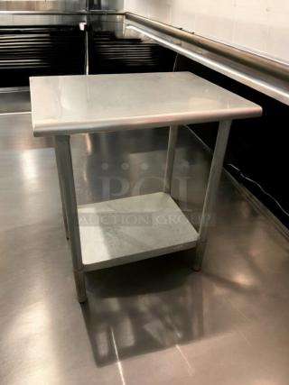 Stainless steel prep table in prime condition, featuring a sturdy workspace and lower shelf; fully tested and ready for use.