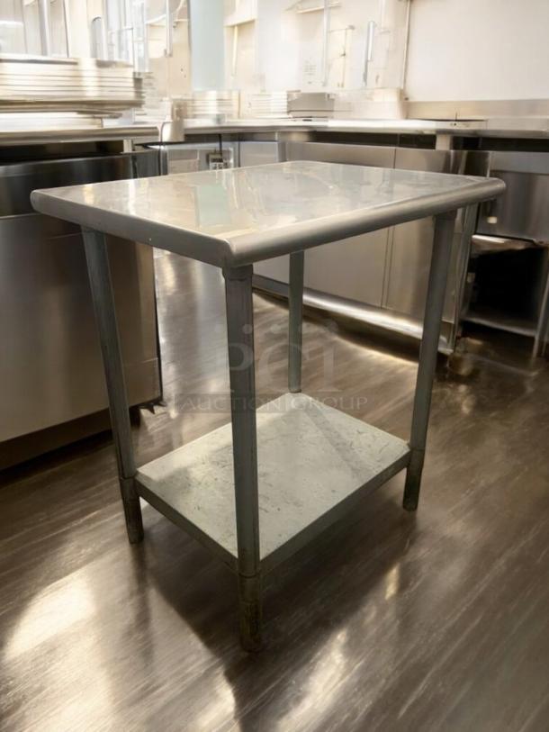 Used stainless steel prep table in prime condition. Features polished top, lower shelf, and sturdy legs. Fully tested and ready.