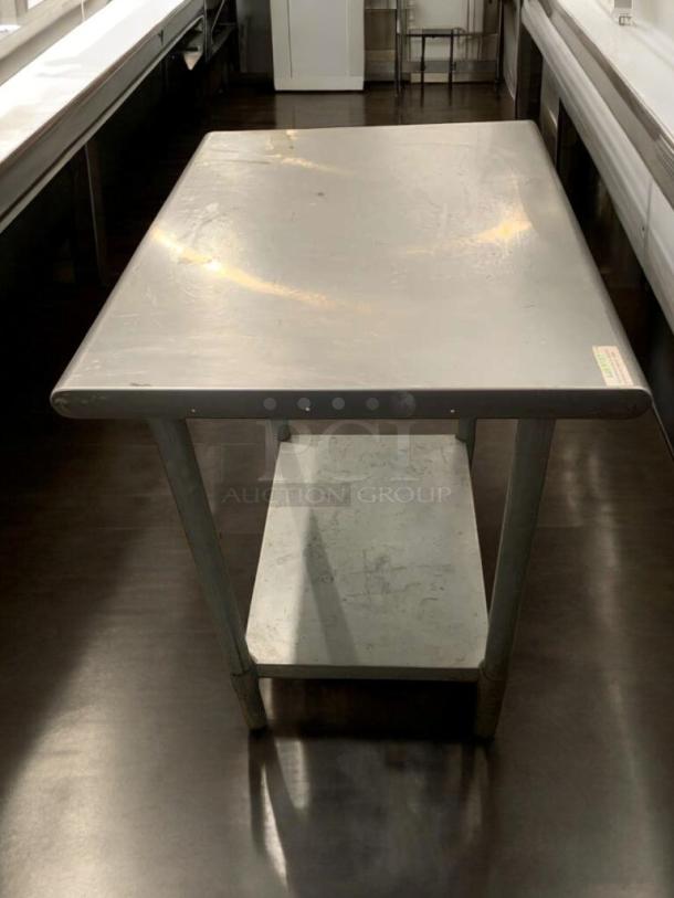 Used stainless steel prep table in prime condition with shelf, commercial grade, fully tested and ready for use.