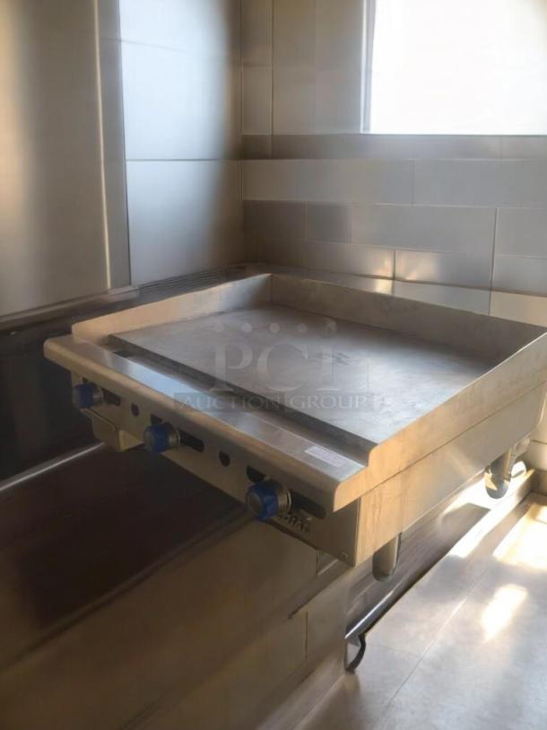 Pristine Commercial Stainless Steel Flat Top Griddle, fully tested, excellent condition, visible control knobs.