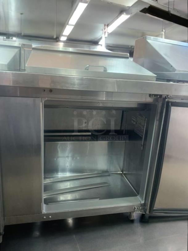 Continental Refrigeration undercounter prep table, stainless steel, fully tested, working condition, open compartment view.