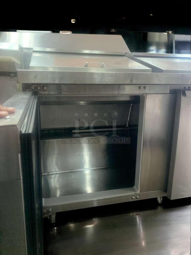 Continental Refrigeration undercounter prep table, stainless steel, open door, fully tested and working condition.