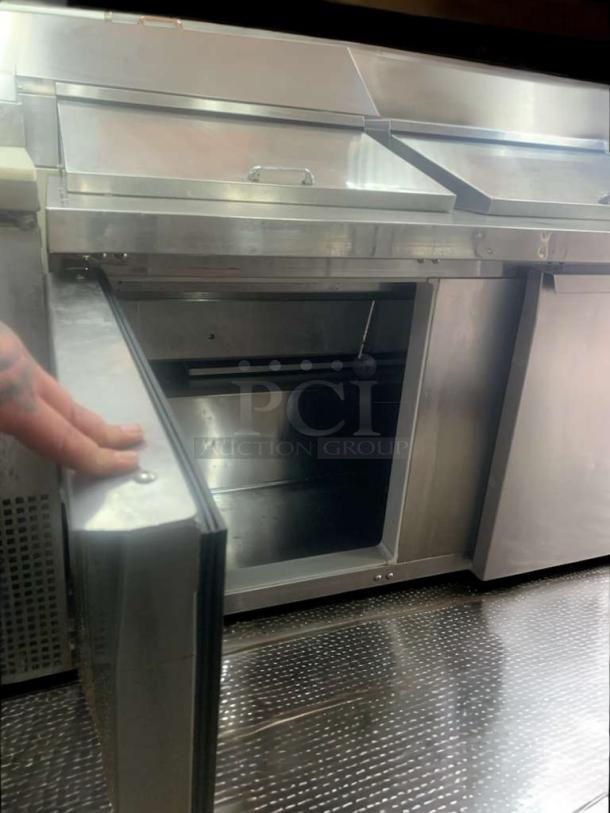 Continental Refrigerator undercounter prep table, stainless steel, open door, fully tested and working, clean interior.