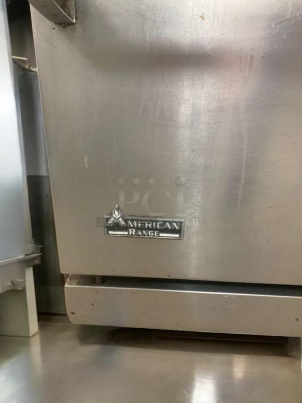 American Range commercial gas range in prime condition, featuring an oven. Fully tested and working, visible brand logo.