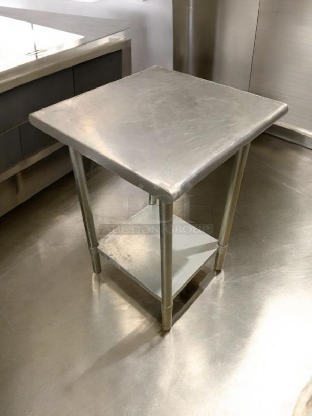 24" stainless steel prep table in flawless condition, commercial grade, heavy-duty, fully tested, with lower shelf.