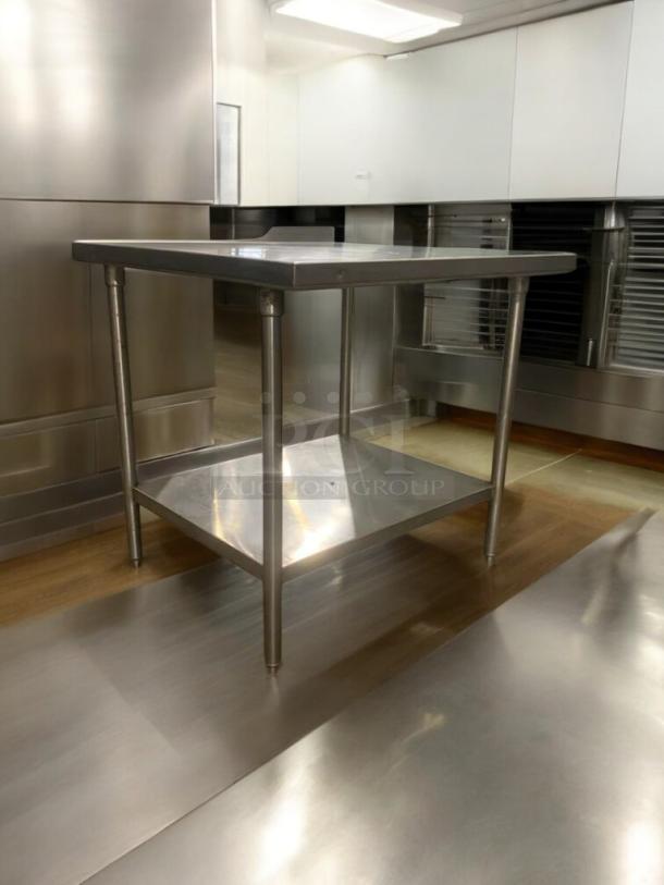 36" stainless steel prep table in superior condition; commercial-grade, heavy-duty, fully tested. Ideal for kitchen use.