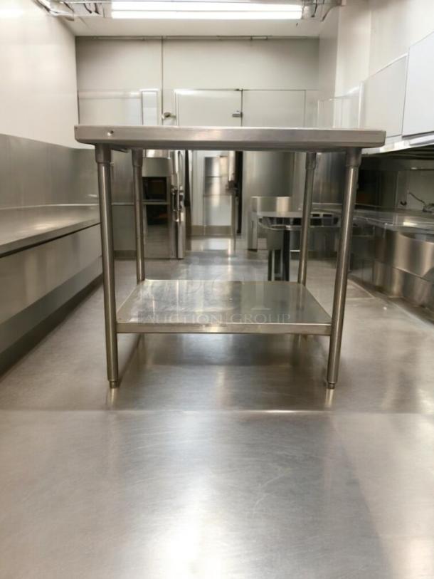 36" stainless steel commercial prep table in superior condition, heavy-duty, fully tested, with reinforced bottom shelf.