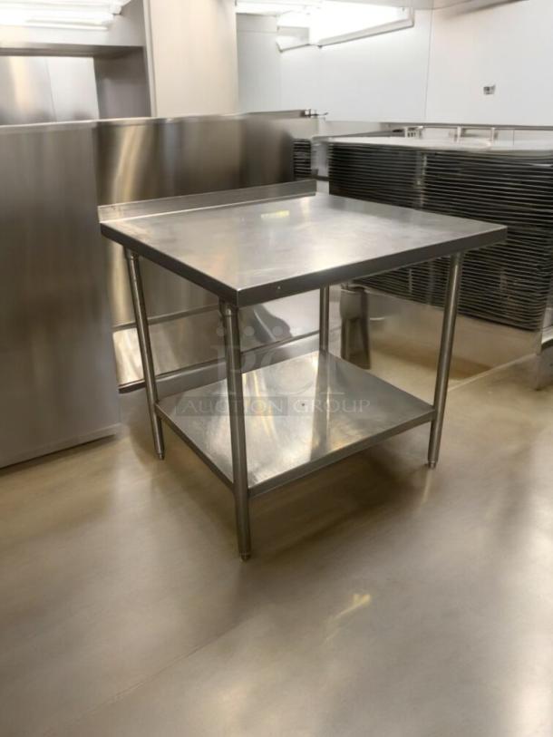 36" stainless steel prep table, commercial grade, superior condition, two-tier, fully tested, heavy-duty construction.