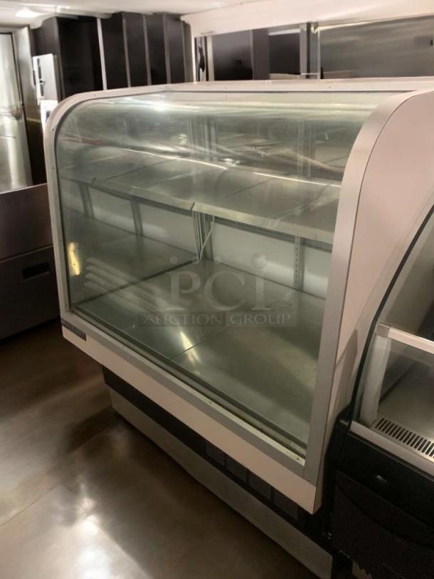 TRUE TCGG-36 refrigerated bakery display case with curved glass in excellent condition; fully tested and functional.