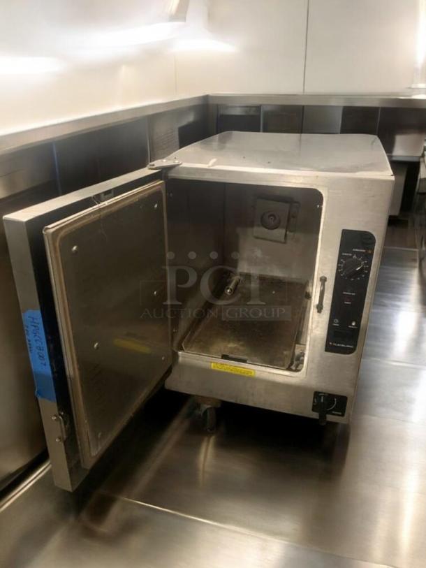 Cleveland SteamChef electric countertop steamer oven in commercial grade condition, open door, stainless steel, fully tested.