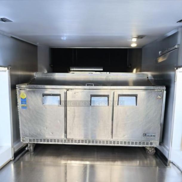 Continental Refrigerator sandwich prep table in top-tier condition, fully tested and working. Stainless steel, three-door model.