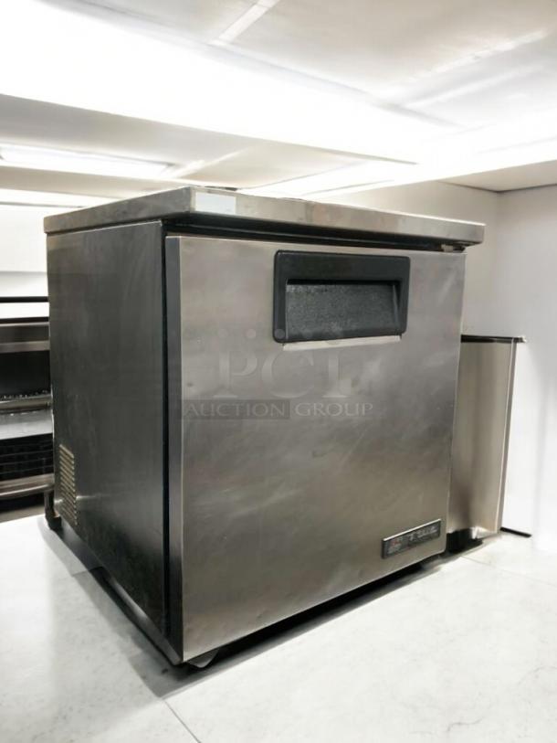 Prime condition True TUC-27-LP undercounter refrigerator, stainless steel, fully tested and working, True Manufacturing label visible.